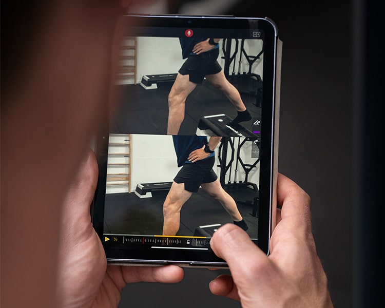 A physiotherapist is doing a side-by-side comparison with myDartfish Mobile