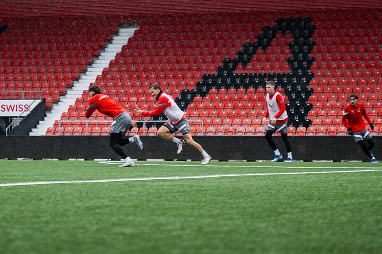 Football players chasing the ball